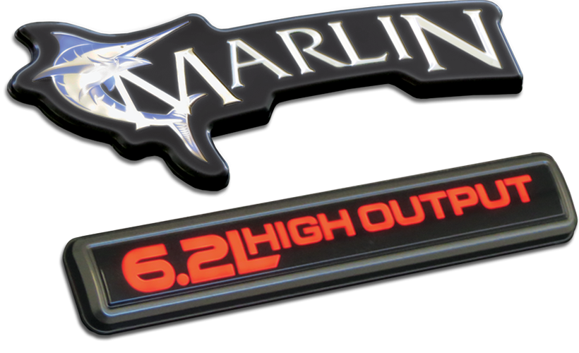 Backlit 3D chrome logo badges with light